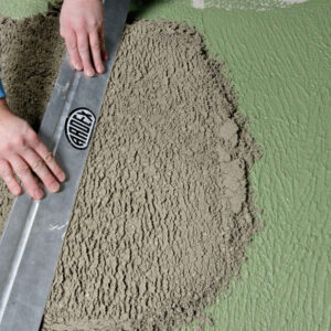 Screeding on ARDEX A 18 slurry bond